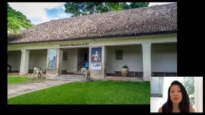 video still of Aimee Ng and building