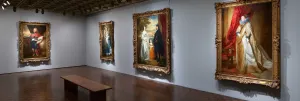 view of a Frick Madison gallery with several large portrait paintings