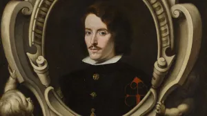 Oil portrait of man with long dark hair, in an elaborately painted frame