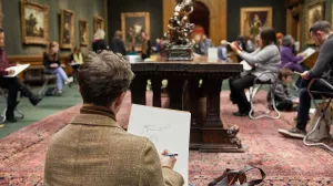 man sketching in The Frick Collection gallery
