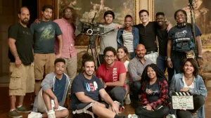 students with filming gear in Frick gallery