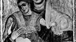 A restored half-length painting of the Virgin Mary wearing a veil holding the Baby Jesus.