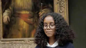 student reading poetry in the Frick Collection