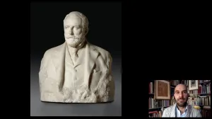 video still of Xavier Salomon and white marble bust of man