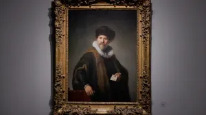 video still of painting of man holding note