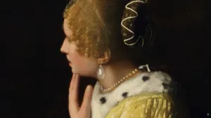 closeup of painting of woman in yellow dress with large pearl earring