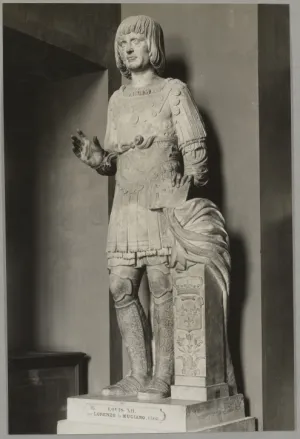 Marble statue of King Louis XII of France in military garb with his right hand raised