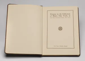Book open to its title page at right