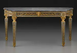 blue-gray marble table with gilt bronze decorations by Gouthière