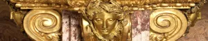 closeup of ornate golden face decorating table
