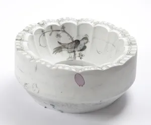 white scallop bowl with blue birddrawn inside