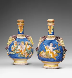 Two earthenware flasks with protruding goat heads as handles. One flask depicts a group of people floating in a body of water with one holding a trident at the center. The other flask depicts two small figures holding horns and riding a sea creature.