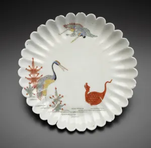 photo of white porcelain dish decorated with cranes and dragon