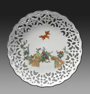white porcelain dish decorated with colorful creatures and foliage