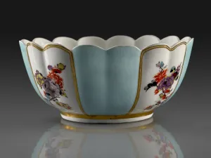 photo of gold, blue and white porcelain bowl with ridges, decorated with flowers