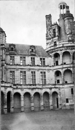 black and white photograph of three storey stone mansion with turret and cupola