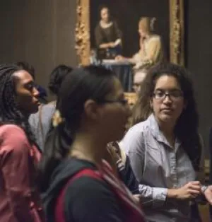 Photograph of people looking art in the West Gallery
