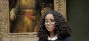 student reading poetry in the Frick Collection