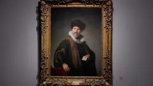 video still of painting of man holding note