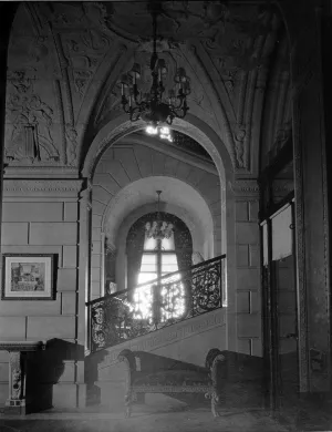 photo of archway, vestibule and side of staircase, with lighting fixture, circa 1927